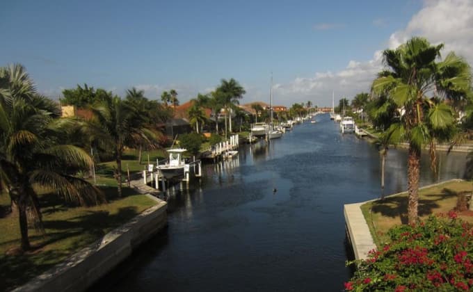 Palm-lined residential canal in Punta Gorda, FL